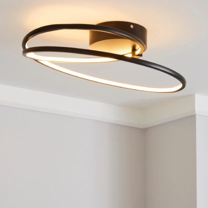 An Image of Menton Integrated LED Swirl Matt Black Semi-Flush Ceiling Fitting Black