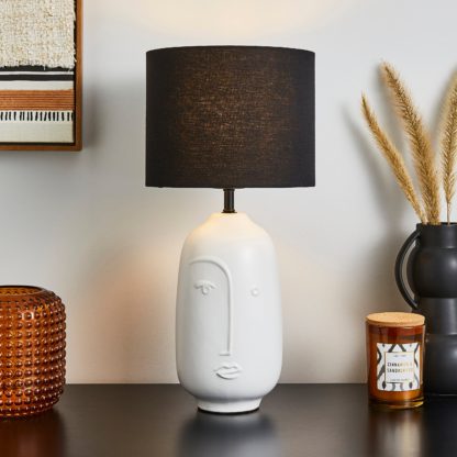 An Image of Faces Table Lamp Black