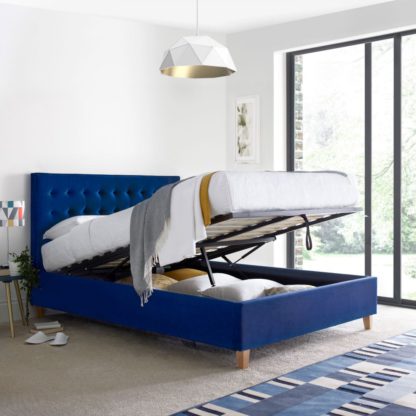 An Image of Kingham Blue Velvet Fabric Ottoman Storage Bed Frame - 5ft King Size