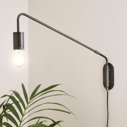 An Image of Braddy Arc Plug in Wall Light Black