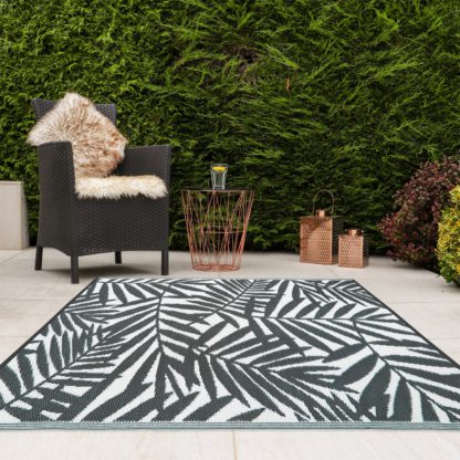 An Image of JVL Leaves Reversible Plastic Woven Outdoor Rug Grey