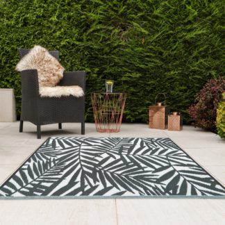 An Image of JVL Leaves Reversible Plastic Woven Outdoor Rug Grey