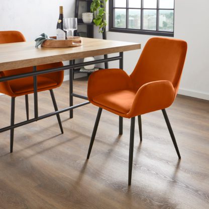 An Image of Axel Velvet Dining Chair Orange Umber