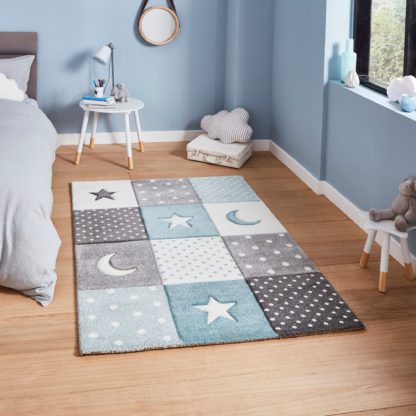 An Image of Blue Moons and Stars Dot Rug blue