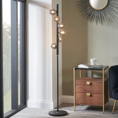 An Image of Blair Smoke Glass Ball and Black Metal Floor Lamp Grey