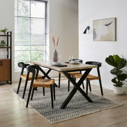 An Image of Ezra Rectangular Extendable Dining Table with Melia Black Dining Chairs