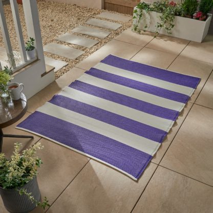 An Image of Stripe Plastic Outdoor Mat Purple