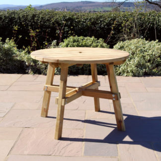 An Image of Freya Round Dining Table Natural