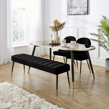 An Image of Sylvia Oval Dining Table with Sylvia Black Velvet Dining Bench & Chairs