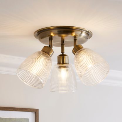 An Image of Kibworth Ribbed 3 Light Adjustable Spotlight Brass