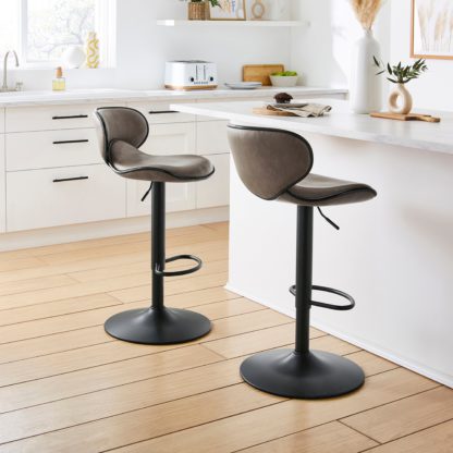 An Image of Donte Adjustable Height Swivel Bar Stool Tan