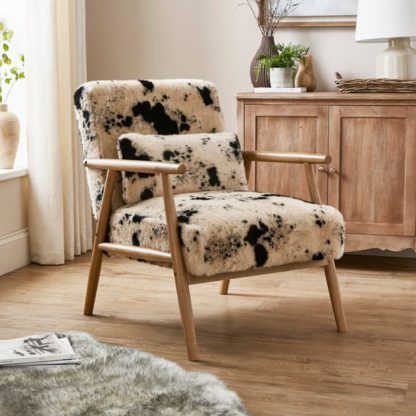 An Image of Alpine Cow Print Faux Fur Spindle Accent Chair