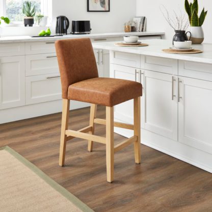 An Image of Oakley Counter Height Bar Stool, Tan Faux Leather