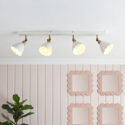 An Image of Remi Scalloped 4 Light Adjustable Spotlight Bar