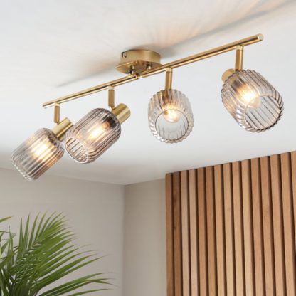 An Image of Riley Mid Century Ribbed 4 Light Adjustable Spotlight Bar